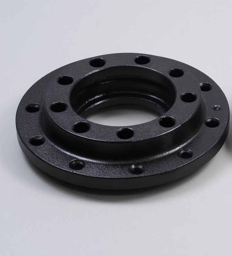 Steel flange before laser coating removal — black powder coat