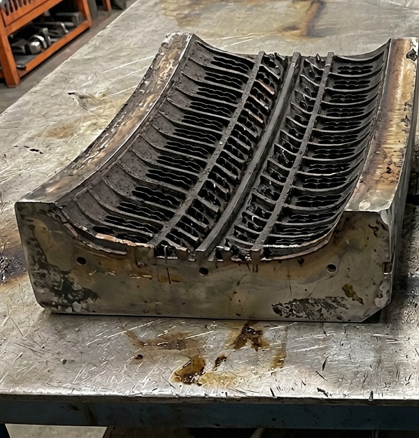 Tyre mold before laser cleaning — heavy carbonised rubber residue